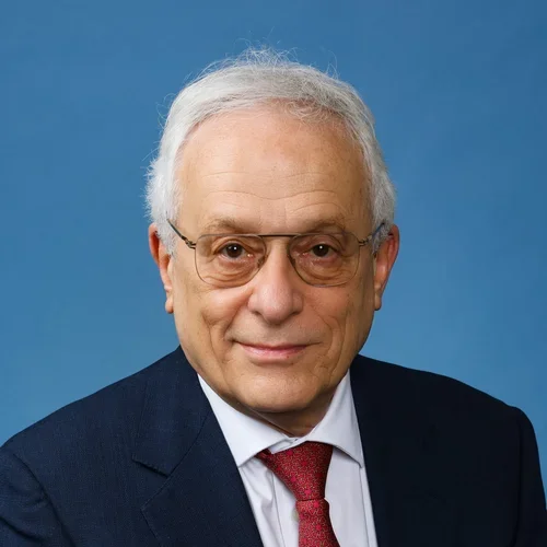 Tomas Ganz (older male in a jacket and tie)