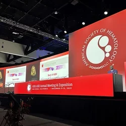 Large red-decorated podium with Elizabeta Nemeth presenting